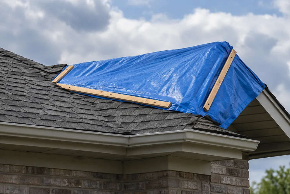 Roof Tarping — illustrative restoration scene