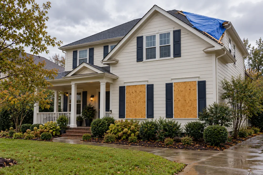Temporary protection on storm-damaged windows and a roof